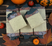 Load image into Gallery viewer, Handmade Pumpkin Apple Butter Soap with black swirls and fall pumpkins in the background